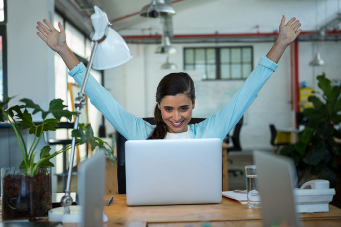 stock-photo-excited-female-business-exec-2204802-082689-edited.png